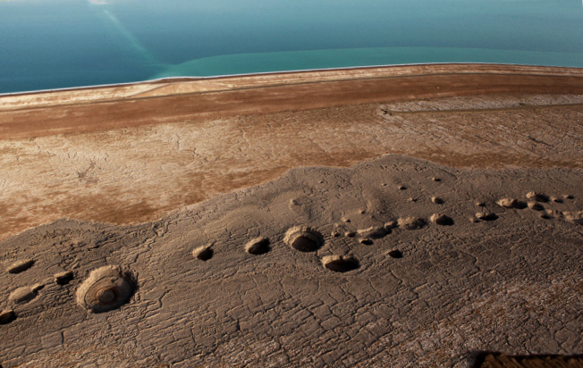 Karst sinkholes on the shore of Dead Sea